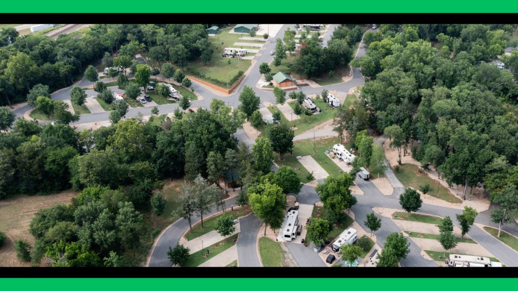 Aerial view of RiverView RV & Recreational Park surrounded by mature trees in Colbert, Oklahoma